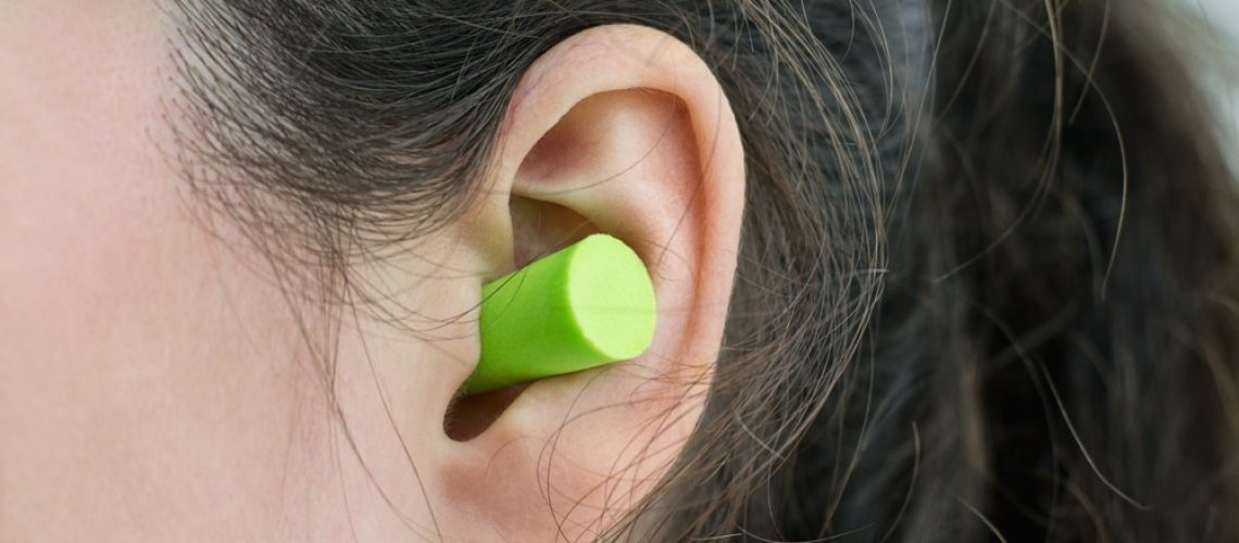 Woman's,Ear,With,An,Ear,Plug,,Noice,Reduce,,Noice,Pollution