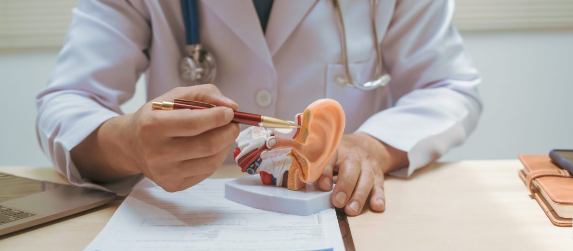Male,Doctor,Treating,Ear,Diseases,At,A,Hospital,,Discussing,Conditions